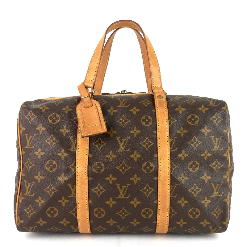 Ladies Louis Vuitton Petite Malle bags with a star - shaped charm for cutenessSac Souple 35 Monogram Canvas Duffle Bag